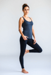 Graceful Balance: Female Yoga Instructor in Motion