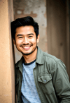 Casual Man Beside Rustic Wall