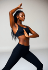 Elegant Strength: Female Instructor's Empowered Pose