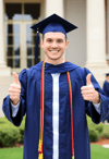 Elation: Caucasian Man Beams in Graduation Regalia