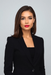 Confident Female Executive Against a Modern Backdrop