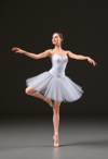 Elegant Arabesque by a Female Ballerina