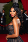 Glamorous Icon in a Flowing Regal Dress