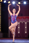 Enchanting Aerialist in a Whirl of Colors