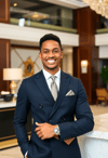Graceful Male Concierge Offering Warm Welcome