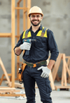 Confident Male Construction Worker with Drill