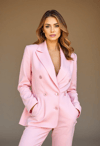 Serene and Stylish: Woman in Soft Pink Suit