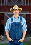 Proud Male Farmer by Rustic Barn
