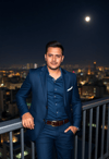 Sophisticated Suave: Man Against an Urban Nightscape