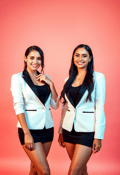 Radiant Reflections: Female Twins in Elegant Casual Wear