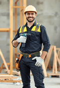 Confident Male Construction Worker with Drill