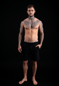 Bold Expression: Male Tattoo Model in Focus