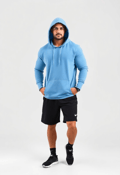 Sporty Vibes: Man in Light Blue Hoodie