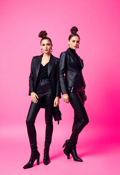 Chic Twin Sisters in Bold Fashion Statements