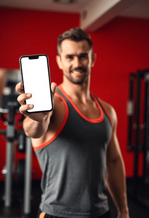 Fitness Trainer With Blank Phone in a Gym