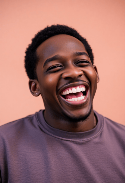 Young Black Man with Vibrant Expressions Caught in Mid-Laugh