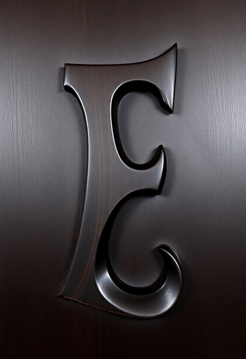 Elegant Ebony: The Letter 'E' in a Rich Heartwood Finish